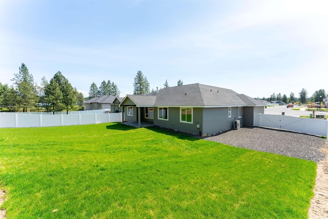 25721 N Ranchette Ct, Chattaroy, WA 99003 - rear view of property featuring a patio area, roof with shingles, fence, and a yard