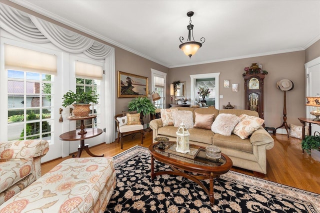 living room with light wood finished floors and ornamental molding