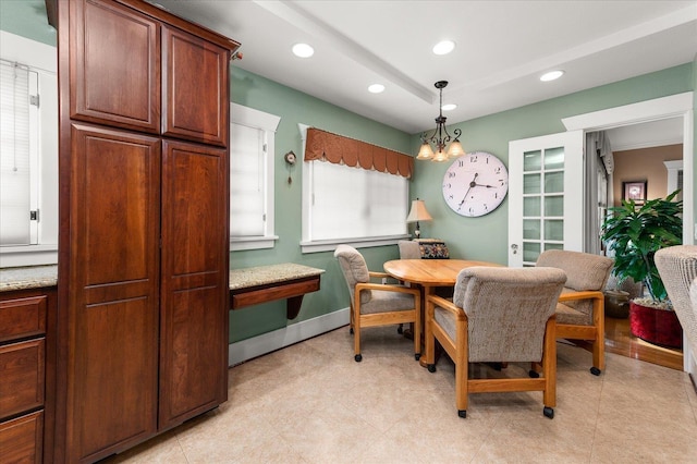 dining area featuring an inviting chandelier, baseboards, and recessed lighting