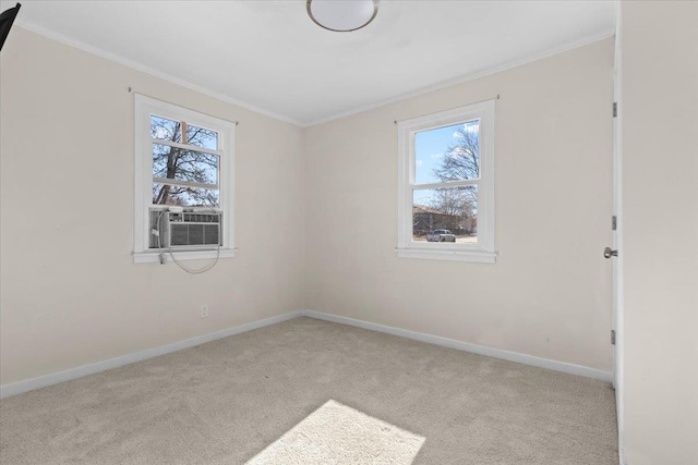 unfurnished room featuring plenty of natural light, carpet flooring, and crown molding