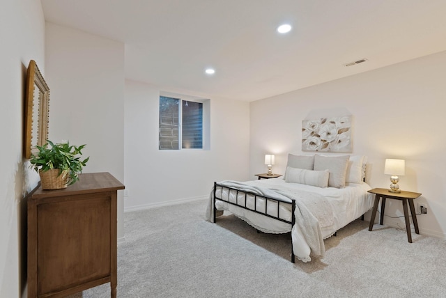 bedroom with recessed lighting, visible vents, baseboards, and light colored carpet