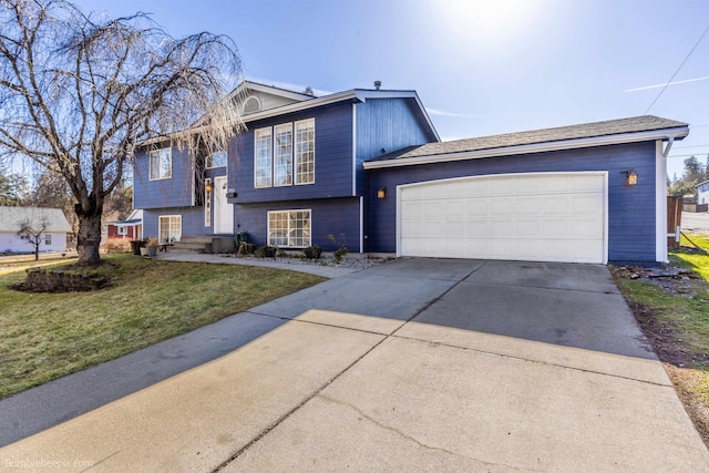 view of front facade with a garage, concrete driveway, a front yard, and entry steps