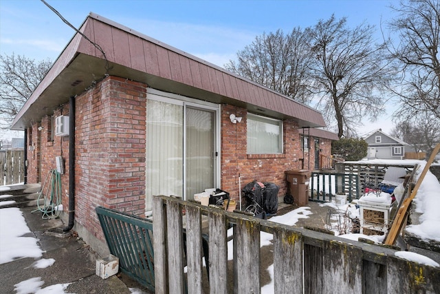 exterior space featuring brick siding