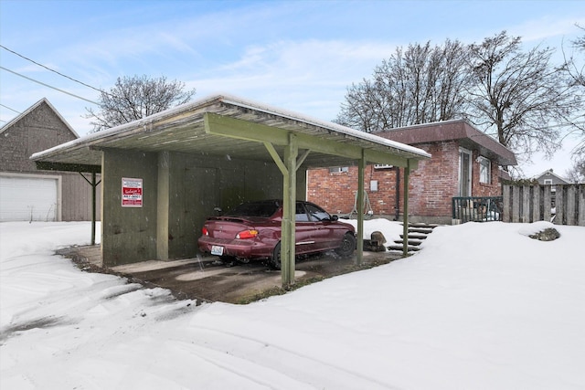 view of snow covered parking