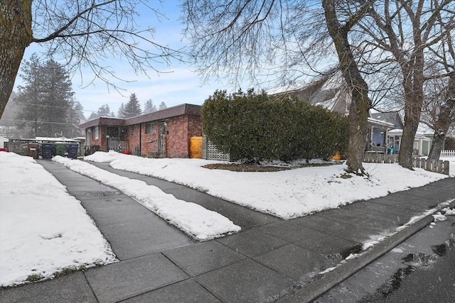 exterior space with brick siding