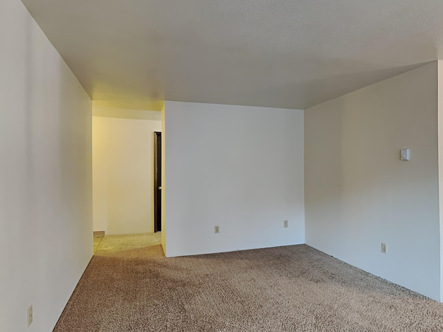 unfurnished room with carpet