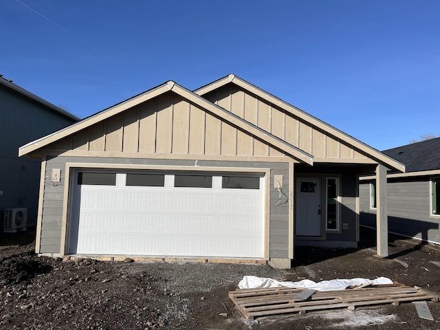 ranch-style house featuring board and batten siding, ac unit, and an attached garage