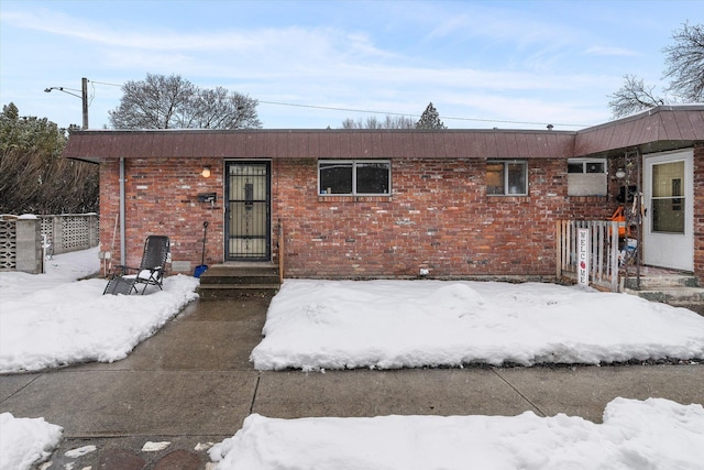 ranch-style house with brick siding and fence