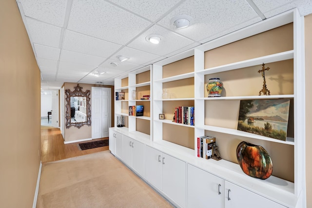 corridor featuring a paneled ceiling