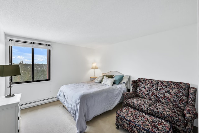 bedroom with light colored carpet, a textured ceiling, and baseboard heating