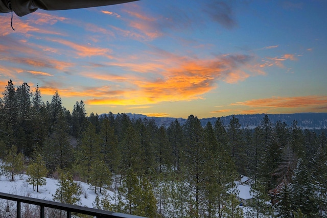 mountain view with a wooded view