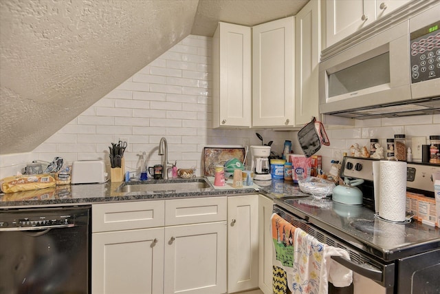 kitchen featuring white microwave, a sink, white cabinets, stainless steel electric stove, and dishwasher