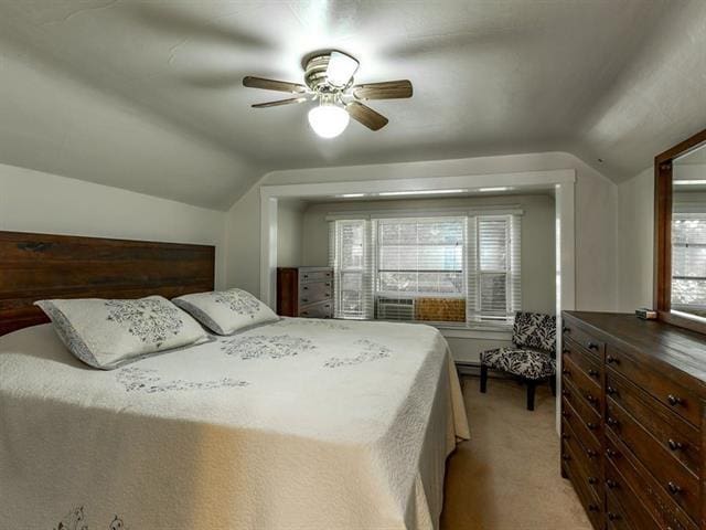 bedroom with lofted ceiling, cooling unit, a ceiling fan, and light colored carpet