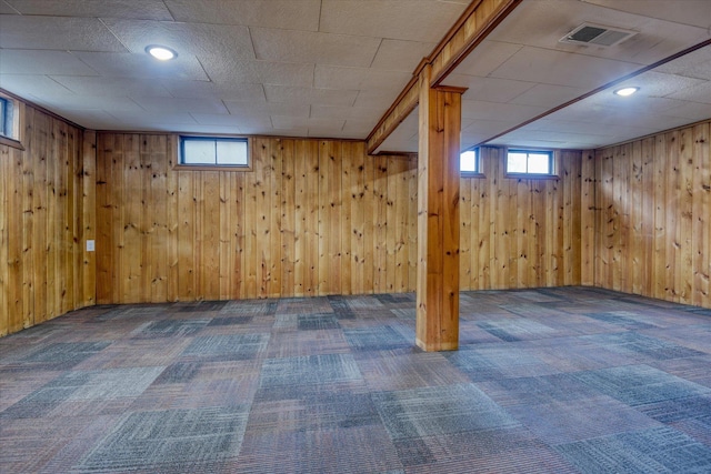 below grade area with plenty of natural light, carpet flooring, and visible vents