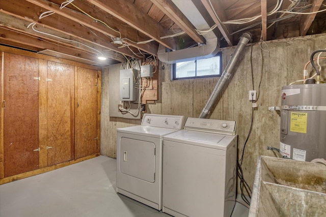 laundry area featuring laundry area, separate washer and dryer, a sink, water heater, and electric panel