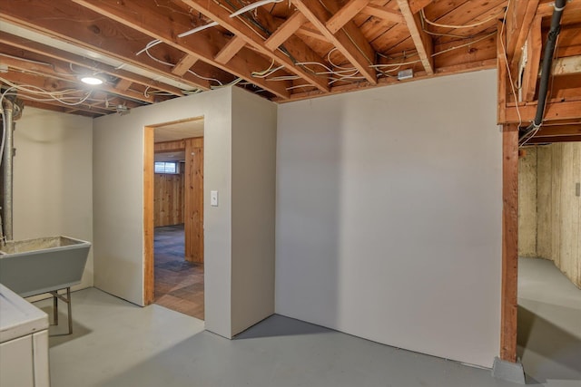 unfinished basement featuring a sink