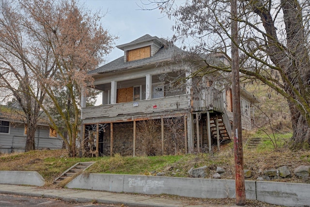 view of front of home with stairway