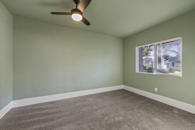 empty room featuring ceiling fan, carpet floors, and baseboards