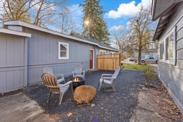 view of yard with an outdoor fire pit and a patio