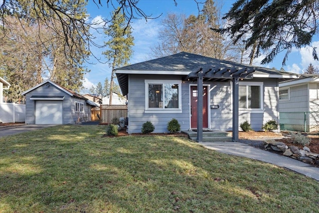 bungalow with driveway, roof with shingles, an outbuilding, fence, and a front yard