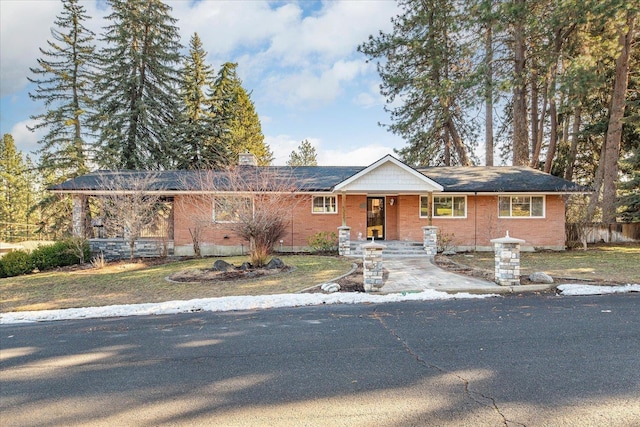 ranch-style home with brick siding