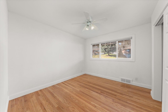 unfurnished bedroom featuring a ceiling fan, light wood-type flooring, visible vents, and baseboards