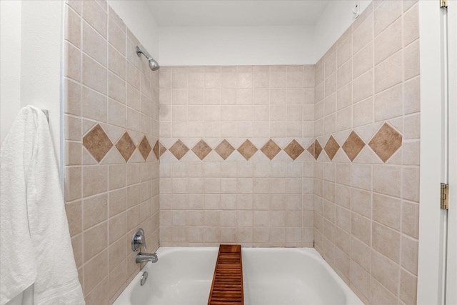 bathroom with bathing tub / shower combination