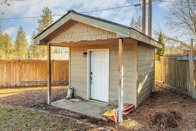 view of shed with a fenced backyard