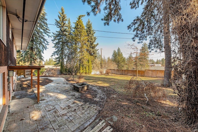 view of yard featuring a patio area and a fenced backyard