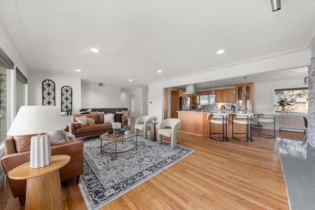 living area featuring recessed lighting and light wood finished floors