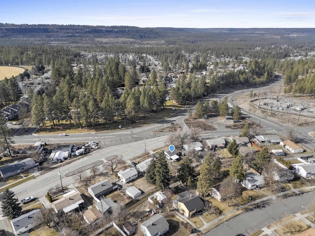 aerial view featuring a wooded view