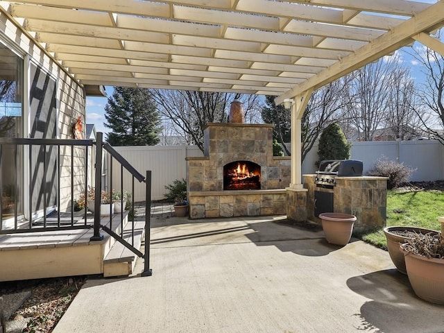 view of patio / terrace with an outdoor stone fireplace, area for grilling, a fenced backyard, and a pergola