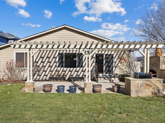 rear view of house with a patio area, a pergola, and a yard