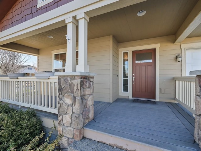 doorway to property featuring covered porch