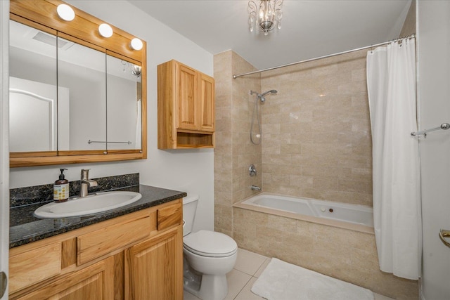 full bathroom featuring visible vents, toilet, tile patterned floors, tiled shower / bath, and vanity
