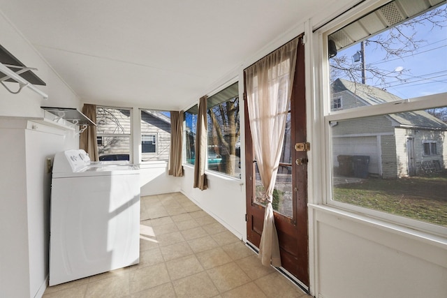 unfurnished sunroom with washer / dryer