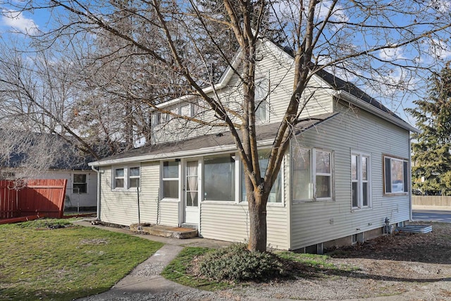 view of front of house with entry steps and fence