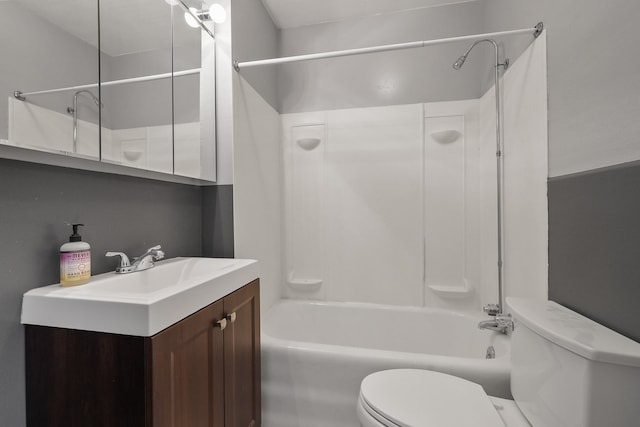 full bath featuring tub / shower combination, vanity, and toilet