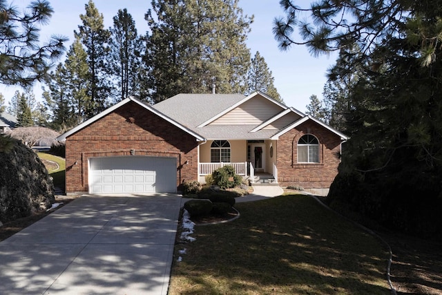 ranch-style house with a garage, concrete driveway, a porch, a front lawn, and brick siding