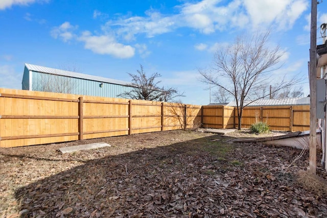 view of yard with a fenced backyard