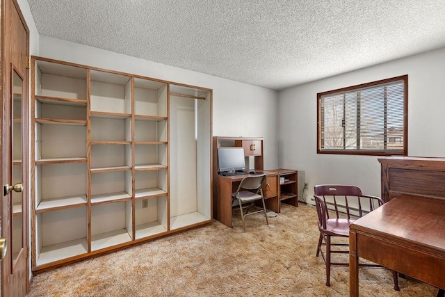 carpeted office space with a textured ceiling and baseboard heating