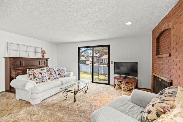 carpeted living area with a textured ceiling, a fireplace, and recessed lighting