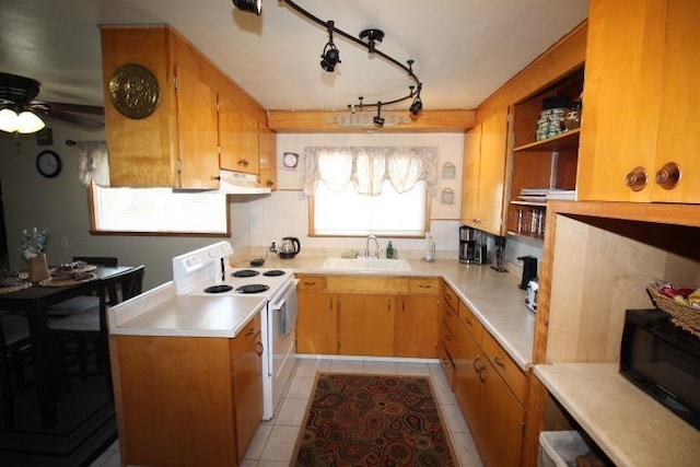 kitchen featuring white electric stove, open shelves, light countertops, a sink, and black microwave