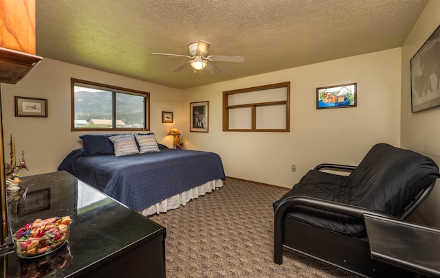 carpeted bedroom featuring a ceiling fan, a textured ceiling, and baseboards