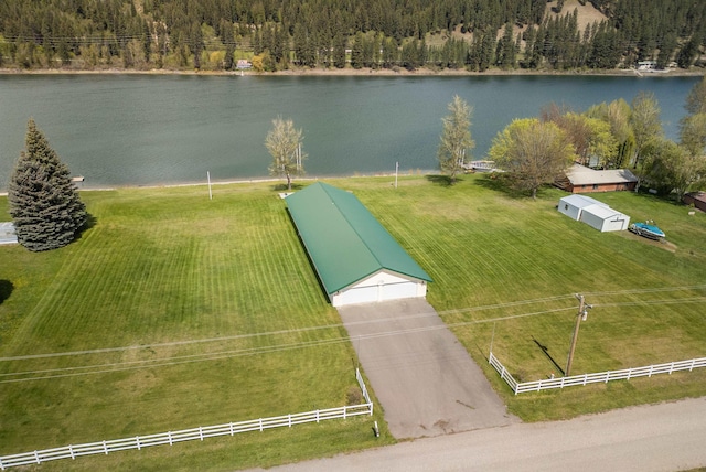 birds eye view of property with a rural view and a water view