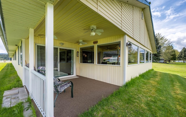 view of property exterior with ceiling fan and a yard