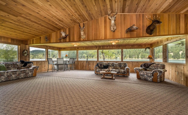 sunroom / solarium featuring lofted ceiling and wooden ceiling