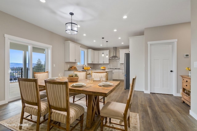 dining space featuring dark wood-style flooring, recessed lighting, and baseboards