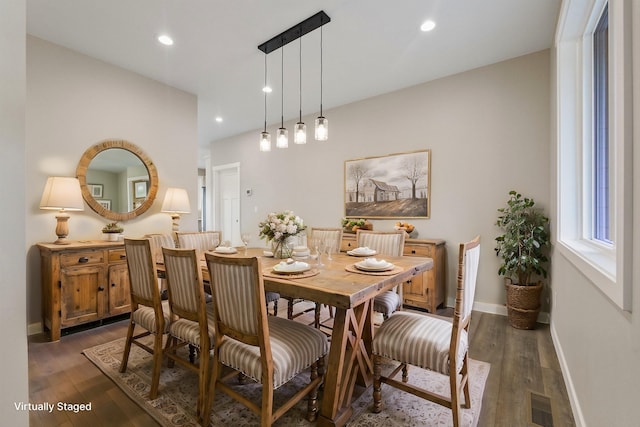 dining area with baseboards, wood finished floors, visible vents, and recessed lighting