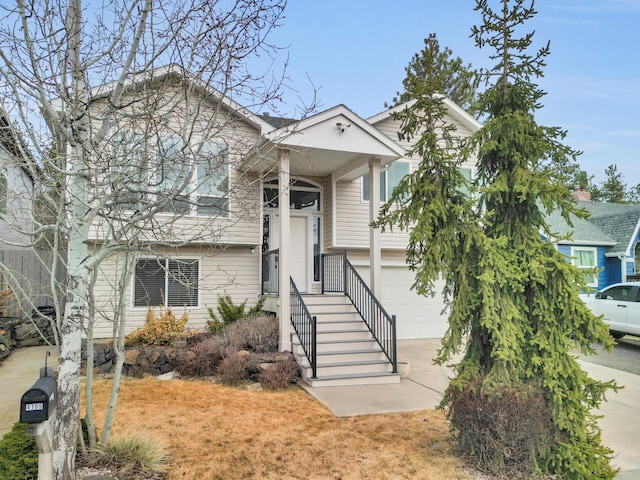 view of front facade featuring concrete driveway and an attached garage